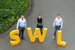 Bild 2: Das SWL-IT-Team freut sich über „seinen“ neuen Azubi im Bereich IT-Fachinformatiker Systemintegration Timo Herbst (mitte).